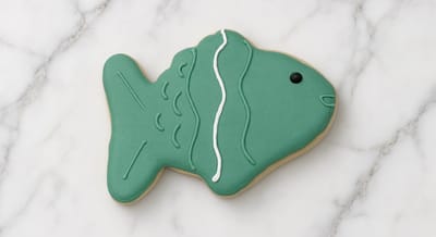Green fish cookie for an under-the-sea baby shower — custom decorated cookies by Dreams of Buttercream